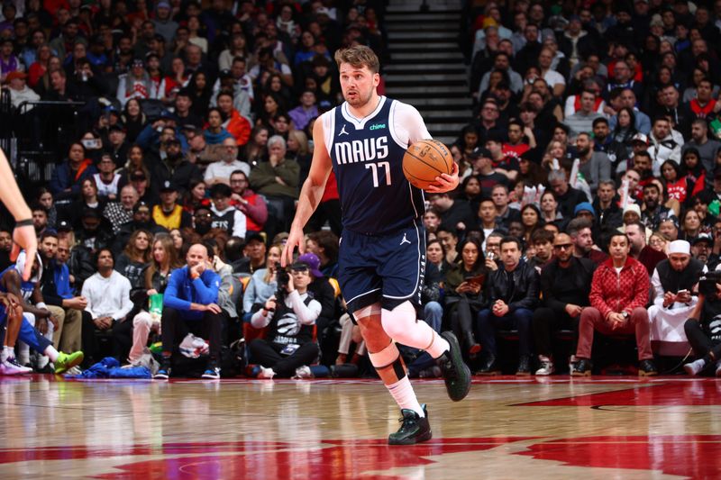 TORONTO, CANADA - FEBRUARY 28: Luka Doncic #77 of the Dallas Mavericks drives to the basket during the game against the Toronto Raptors on February 28, 2024 at the Scotiabank Arena in Toronto, Ontario, Canada.  NOTE TO USER: User expressly acknowledges and agrees that, by downloading and or using this Photograph, user is consenting to the terms and conditions of the Getty Images License Agreement.  Mandatory Copyright Notice: Copyright 2024 NBAE (Photo by Vaughn Ridley/NBAE via Getty Images)