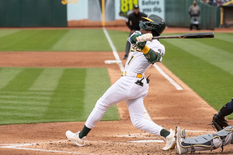 Jun 27, 2023; Oakland, California, USA; Oakland Athletics center fielder Esteury Ruiz (1) hits a RBI single during the third inning against the New York Yankees at Oakland-Alameda County Coliseum. Mandatory Credit: Ed Szczepanski-USA TODAY Sports