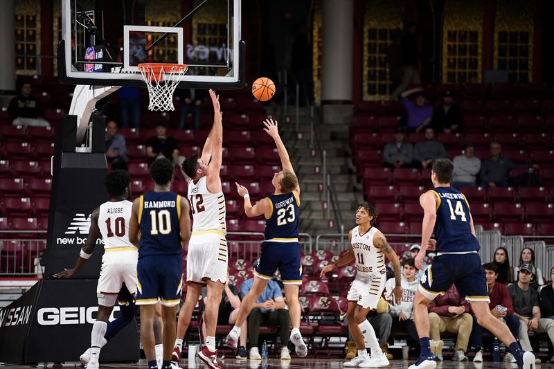 Jan 3, 2023; Chestnut Hill, Massachusetts, USA; Notre Dame Fighting Irish guard Dane Goodwin (23) shoots the ball while defended by Notre Dame Fighting Irish guard Tony Sanders Jr. (12) during the second half at Conte Forum. Mandatory Credit: Eric Canha-USA TODAY Sports