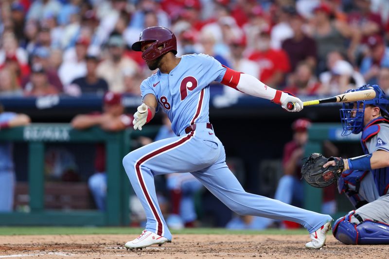 Jul 11, 2024; Philadelphia, Pennsylvania, USA; Philadelphia Phillies outfielder Johan Rojas (18) hits an RBI single during the sixth inning against the Los Angeles Dodgers at Citizens Bank Park. Mandatory Credit: Bill Streicher-USA TODAY Sports