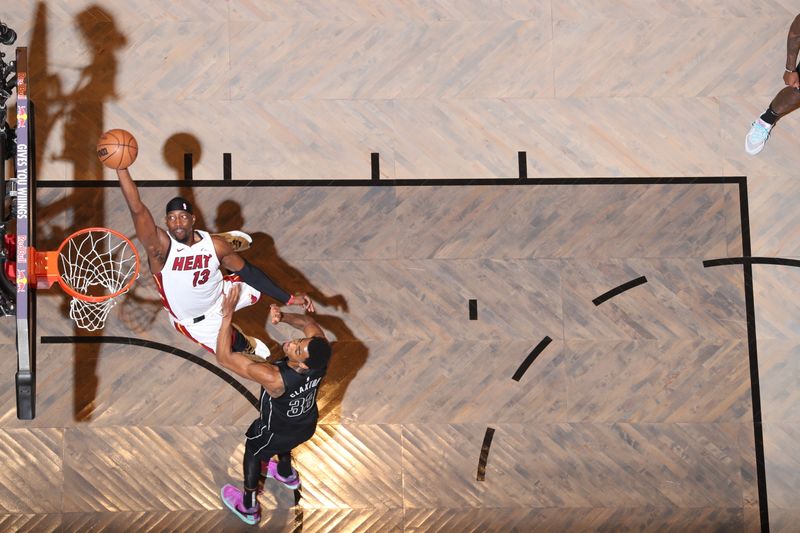 BROOKLYN, NY - JANUARY 15: Bam Adebayo #13 of the Miami Heat drives to the basket during the game against the Brooklyn Nets on January 15, 2024 at Barclays Center in Brooklyn, New York. NOTE TO USER: User expressly acknowledges and agrees that, by downloading and or using this Photograph, user is consenting to the terms and conditions of the Getty Images License Agreement. Mandatory Copyright Notice: Copyright 2024 NBAE (Photo by Nathaniel S. Butler/NBAE via Getty Images)