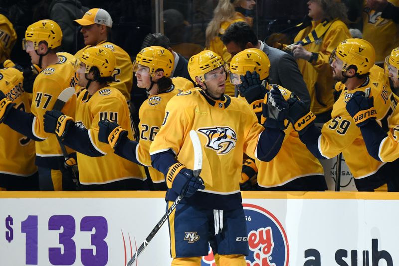 Jan 22, 2024; Nashville, Tennessee, USA; Nashville Predators defenseman Jeremy Lauzon (3) is congratulated by teammates after a goal during the second period against the Florida Panthers at Bridgestone Arena. Mandatory Credit: Christopher Hanewinckel-USA TODAY Sports