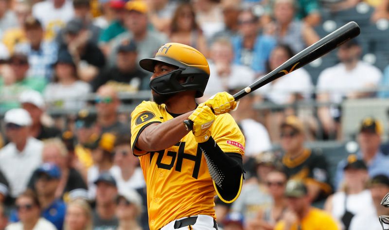 Jun 23, 2024; Pittsburgh, Pennsylvania, USA;  Pittsburgh Pirates right fielder Edward Olivares (38) hits a single against the Tampa Bay Rays during the second inning at PNC Park. Mandatory Credit: Charles LeClaire-USA TODAY Sports