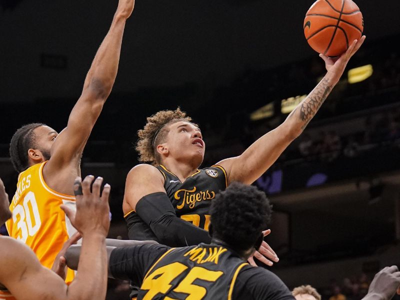 Feb 20, 2024; Columbia, Missouri, USA; Missouri Tigers forward Noah Carter (35) shoots as Tennessee Volunteers guard Josiah-Jordan James (30) defends during the first half at Mizzou Arena. Mandatory Credit: Denny Medley-USA TODAY Sports