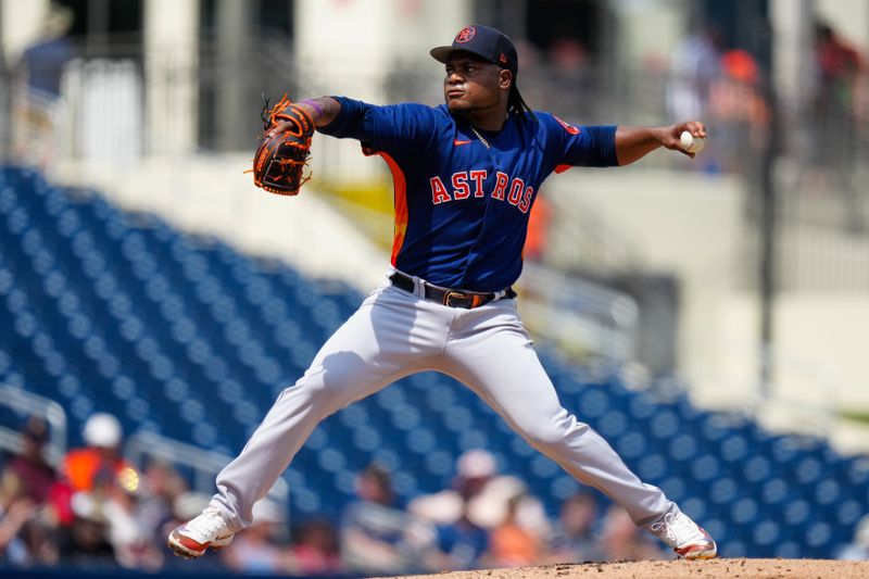 Mar 13, 2023; West Palm Beach, Florida, USA; Houston Astros starting pitcher Framber Valdez (59) throws a pitch against the Washington Nationals during the first inning at The Ballpark of the Palm Beaches. Mandatory Credit: Rich Storry-USA TODAY Sports