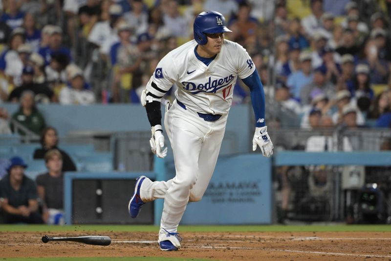 Jul 22, 2024; Los Angeles, California, USA;  Los Angeles Dodgers designated hitter Shohei Ohtani (17) runs to first on a ground out in the sixth inning against the San Francisco Giants at Dodger Stadium. Mandatory Credit: Jayne Kamin-Oncea-USA TODAY Sports