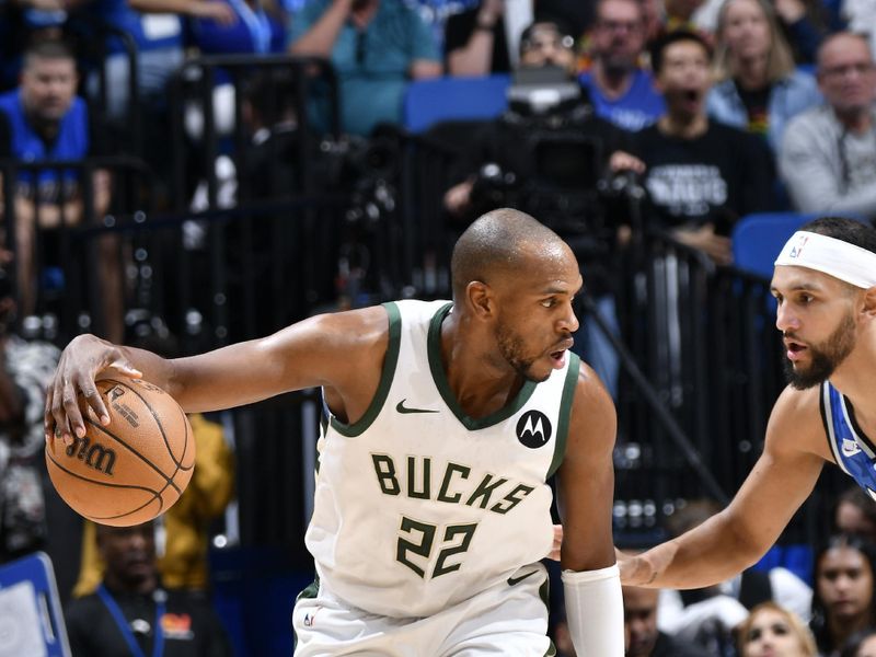 ORLANDO, FL - APRIL 14: Khris Middleton #22 of the Milwaukee Bucks handles the ball during the game against the Orlando Magic on April 14, 2024 at Kia Center in Orlando, Florida. NOTE TO USER: User expressly acknowledges and agrees that, by downloading and or using this photograph, User is consenting to the terms and conditions of the Getty Images License Agreement. Mandatory Copyright Notice: Copyright 2024 NBAE (Photo by Fernando Medina/NBAE via Getty Images)