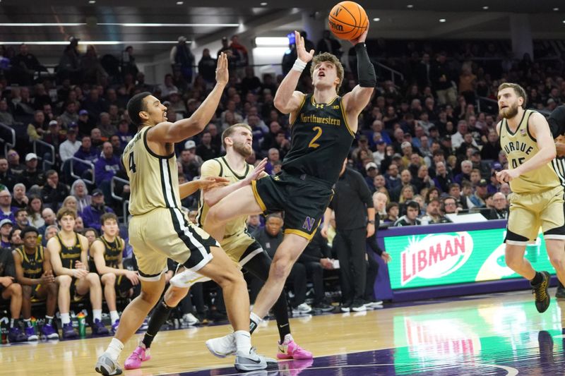 Mar 4, 2026; Evanston, Illinois, USA; Purdue Boilermakers forward Trey Kaufman-Renn (4) defends Northwestern Wildcats forward Nick Martinelli (2) during the second half at Welsh-Ryan Arena. Mandatory Credit: David Banks-Imagn Images