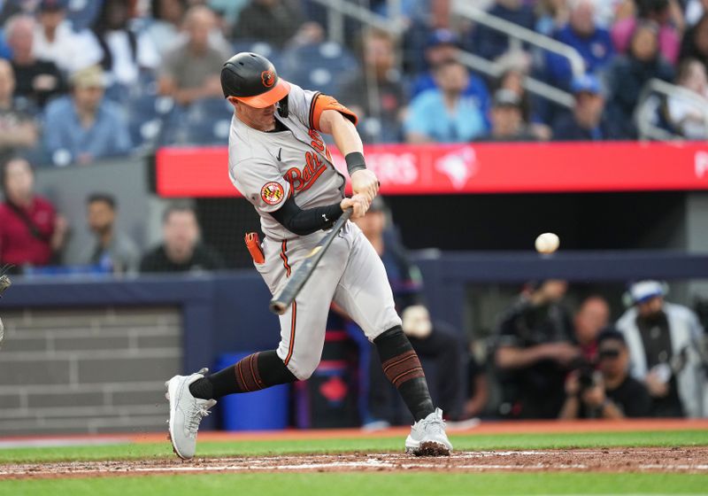 Jun 3, 2024; Toronto, Ontario, CAN; Baltimore Orioles left fielder Austin Hays (21) hits a two run home run against the Toronto Blue Jays during the fourth inning at Rogers Centre. Mandatory Credit: Nick Turchiaro-USA TODAY Sports