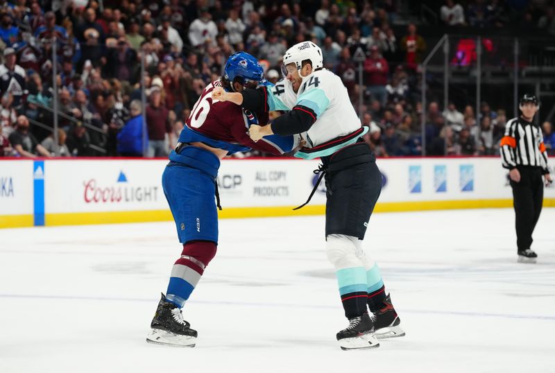 Oct 21, 2022; Denver, Colorado, USA; Colorado Avalanche defenseman Kurtis MacDermid (56) and Seattle Kraken defenseman Jamie Oleksiak (24) fight in the first period at Ball Arena. Mandatory Credit: Ron Chenoy-USA TODAY Sports