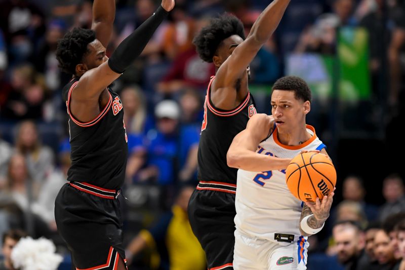 Mar 14, 2024; Nashville, TN, USA;  Georgia Bulldogs forward Jalen DeLoach (23) defends against Florida Gators guard Riley Kugel (2) during the first half at Bridgestone Arena. Mandatory Credit: Steve Roberts-USA TODAY Sports