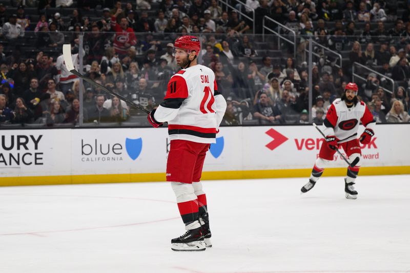 Oct 18, 2025; Los Angeles, California, USA; Carolina Hurricanes center Jordan Staal (11) looks on after scoring during the first period against the Los Angeles Kings at Crypto.com Arena. Mandatory Credit: William Liang-Imagn Images