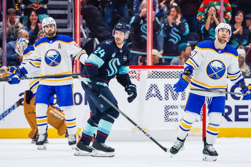 Jan 20, 2025; Seattle, Washington, USA; Seattle Kraken defenseman Jamie Oleksiak (24) reacts after scoring a goal against the Buffalo Sabres during the second period at Climate Pledge Arena. Mandatory Credit: Joe Nicholson-Imagn Images