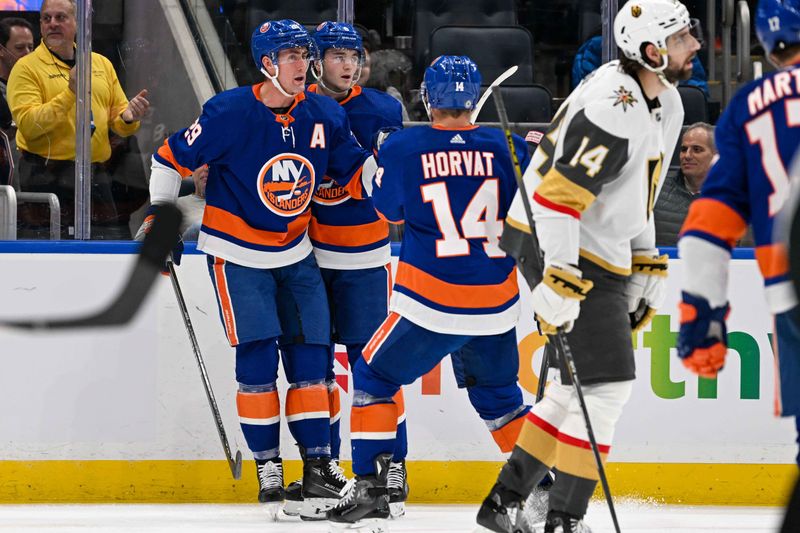 Jan 23, 2024; Elmont, New York, USA;  New York Islanders center Brock Nelson (29) celebrates his goal against the Vegas Golden Knights with defenseman Noah Dobson (8) during the second period at UBS Arena. Mandatory Credit: Dennis Schneidler-USA TODAY Sports