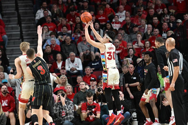 Feb 11, 2023; Lincoln, Nebraska, USA;  Nebraska Cornhuskers guard Keisei Tominaga (30) scores on a three point shot against the Wisconsin Badgers in the second half at Pinnacle Bank Arena. Mandatory Credit: Steven Branscombe-USA TODAY Sports