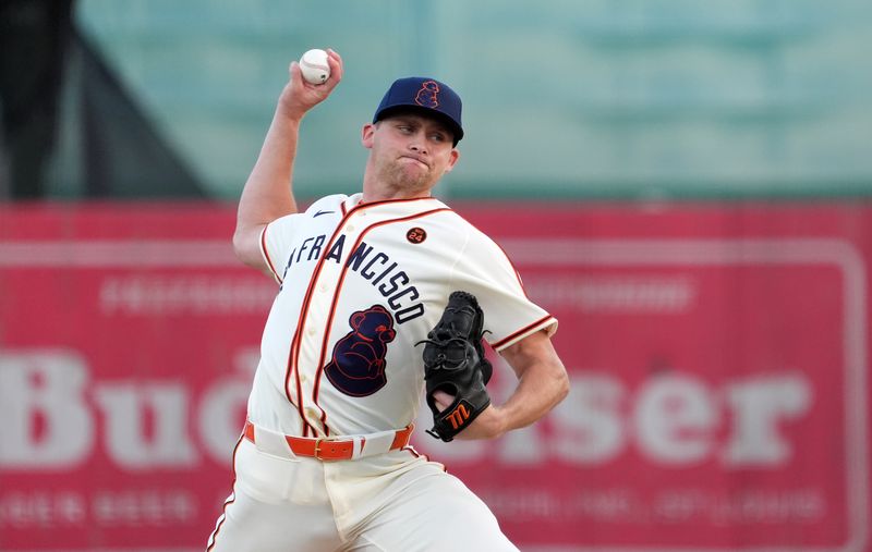 Jun 20, 2024; Fairfield, Alabama, USA; San Francisco Giants pitcher Keaton Winn (67) throws during the 1st inning against the St. Louis Cardinals in the MLB at Rickwood Field tribute game to the Negro Leagues. Rickwood Field is the oldest baseball stadium in America. Mandatory Credit: John David Mercer-USA TODAY Sports