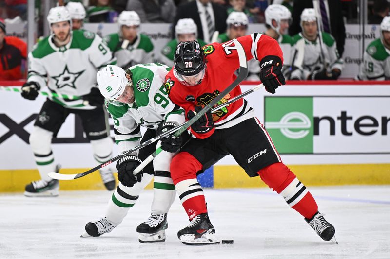 Jan 13, 2024; Chicago, Illinois, USA;  Dallas Stars forward Matt Duchene (95) and Chicago Blackhawks forward Cole Guttman (70) battle for control of the puck in the second period at United Center. Mandatory Credit: Jamie Sabau-USA TODAY Sports