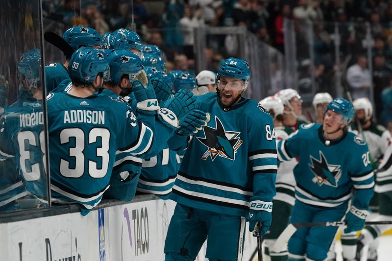 Apr 13, 2024; San Jose, California, USA; San Jose Sharks defenseman Jan Rutta (84) celebrates with the team after scoring a goal during the first period at SAP Center at San Jose. Mandatory Credit: David Gonzales-USA TODAY Sports