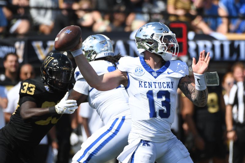 Sep 23, 2023; Nashville, Tennessee, USA; Kentucky Wildcats quarterback Devin Leary (13) throws a pass against the Vanderbilt Commodores during the first half at FirstBank Stadium. Mandatory Credit: Christopher Hanewinckel-USA TODAY Sports