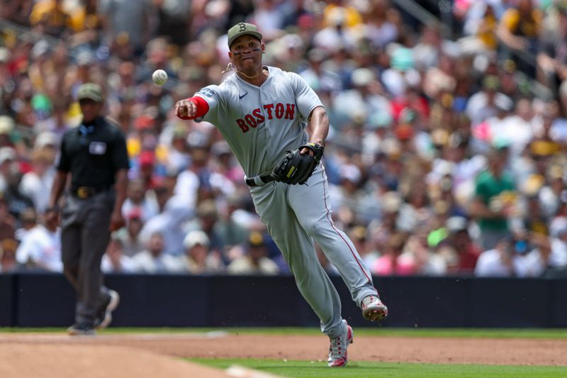 May 21, 2023; San Diego, California, USA;  Boston Red Sox third baseman Rafael Devers (11) throws the ball to first base to record the out in the third inning against the San Diego Padres at Petco Park. Mandatory Credit: David Frerker-USA TODAY Sports