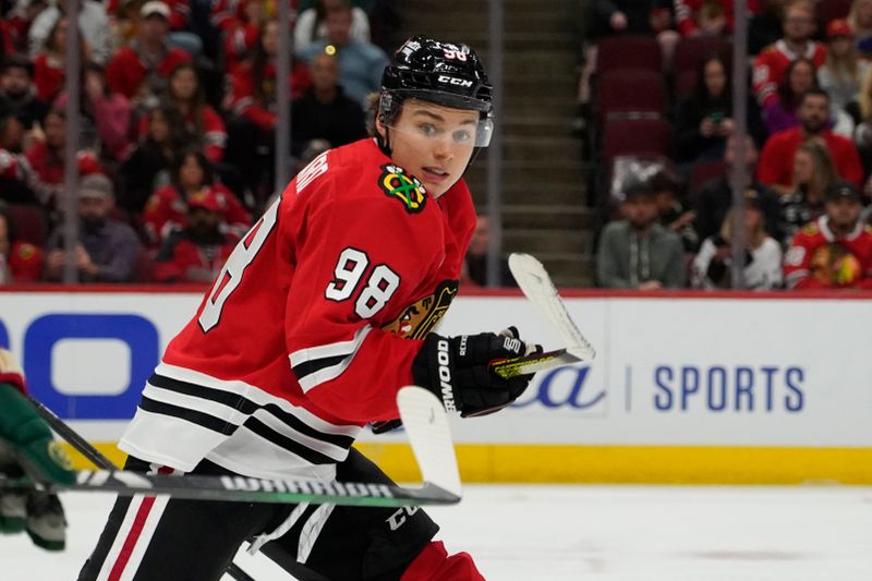 Oct 4, 2024; Chicago, Illinois, USA; Chicago Blackhawks center Connor Bedard (98) plays against the Minnesota Wild during the third period at United Center. Mandatory Credit: David Banks-Imagn Images