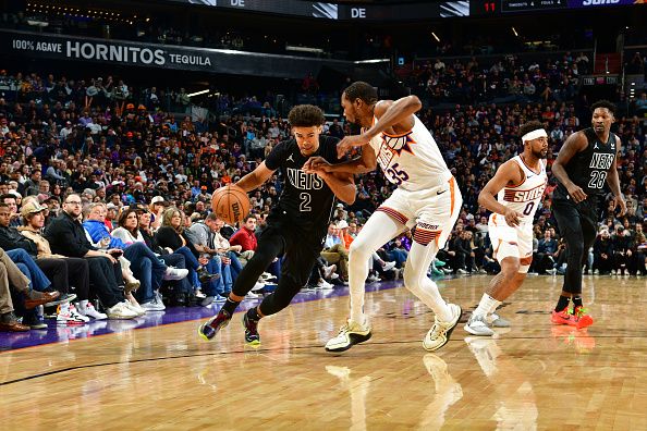 PHOENIX, AZ -DECEMBER 13: Kevin Durant #35 of the Phoenix Suns plays defense against Cameron Johnson #2 of the Brooklyn Nets on December 13, 2023 at Footprint Center in Phoenix, Arizona. NOTE TO USER: User expressly acknowledges and agrees that, by downloading and or using this photograph, user is consenting to the terms and conditions of the Getty Images License Agreement. Mandatory Copyright Notice: Copyright 2023 NBAE (Photo by Kate Frese/NBAE via Getty Images)