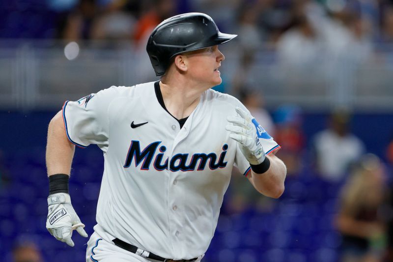 Jun 21, 2023; Miami, Florida, USA; Miami Marlins first baseman Garrett Cooper (26) runs toward second base after hitting a two-run double against the Toronto Blue Jays during the fourth inning at loanDepot Park. Mandatory Credit: Sam Navarro-USA TODAY Sports