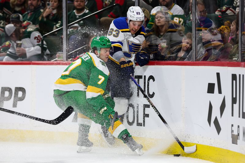 Mar 23, 2024; Saint Paul, Minnesota, USA; Minnesota Wild defenseman Brock Faber (7) and St. Louis Blues left wing Jake Neighbours (63) compete for the puck during the second period at Xcel Energy Center. Mandatory Credit: Matt Krohn-USA TODAY Sports