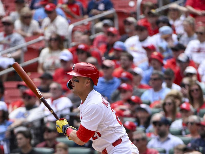 May 7, 2025; St. Louis, Missouri, USA;  St. Louis Cardinals left fielder Lars Nootbaar (21) hits a one run single against the Pittsburgh Pirates during the third inning at Busch Stadium. Mandatory Credit: Jeff Curry-Imagn Images