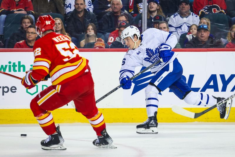 Jan 18, 2024; Calgary, Alberta, CAN; Toronto Maple Leafs right wing Mitchell Marner (16) shoots the puck against the Calgary Flames during the third period at Scotiabank Saddledome. Mandatory Credit: Sergei Belski-USA TODAY Sports