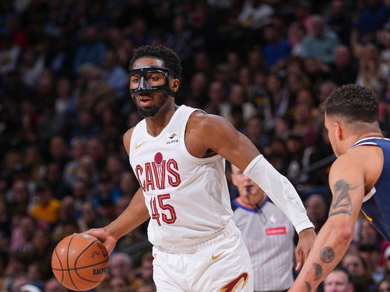 DENVER, CO - MARCH 31: Donovan Mitchell #45 of the Cleveland Cavaliers handles the ball during the game  on March 31, 2024 at the Ball Arena in Denver, Colorado. NOTE TO USER: User expressly acknowledges and agrees that, by downloading and/or using this Photograph, user is consenting to the terms and conditions of the Getty Images License Agreement. Mandatory Copyright Notice: Copyright 2024 NBAE (Photo by Bart Young/NBAE via Getty Images)