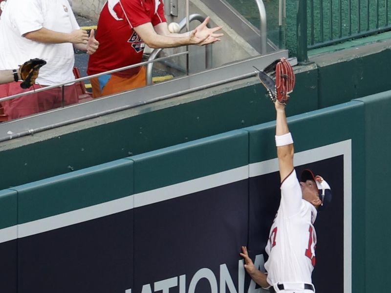 Aug 17, 2023; Washington, District of Columbia, USA; Washington Nationals center fielder Alex Call (17) attempts to catch a grand slam hit by Boston Red Sox third baseman Luis Urias (not pictured) during the seventh inning at Nationals Park. Mandatory Credit: Geoff Burke-USA TODAY Sports