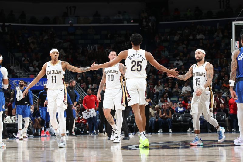 NEW ORLEANS, LA - JANUARY 15:  Brandon Boston Jr. #11, Trey Murphy III #25, and Jose Alvarado #15 of the New Orleans Pelicans high five during the game against the Dallas Mavericks on January 15, 2025 at the Smoothie King Center in New Orleans, Louisiana. NOTE TO USER: User expressly acknowledges and agrees that, by downloading and or using this Photograph, user is consenting to the terms and conditions of the Getty Images License Agreement. Mandatory Copyright Notice: Copyright 2025 NBAE (Photo by Layne Murdoch Jr./NBAE via Getty Images)