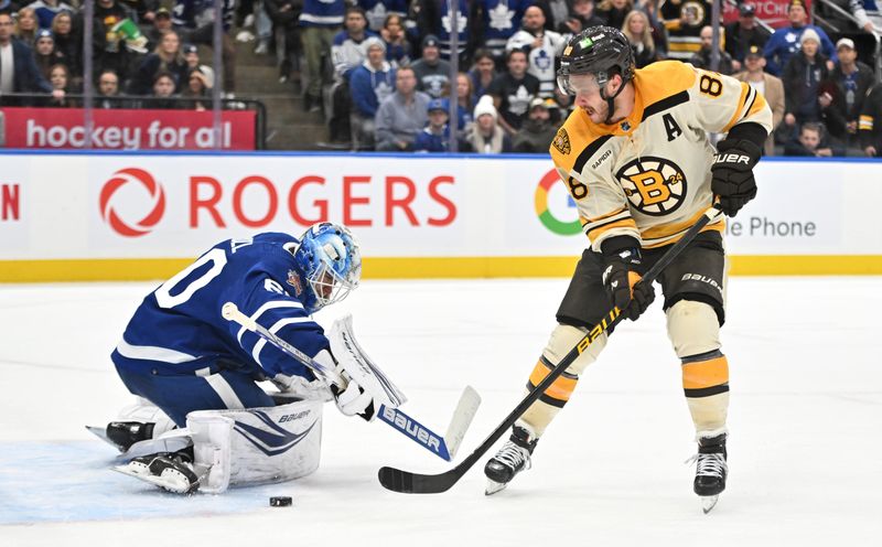 Dec 2, 2023; Toronto, Ontario, CAN; Toronto Maple Leafs goalie Joseph Woll (60) makes a save against Boston Bruins forward David Pastrnak (88) in overtime at Scotiabank Arena. Mandatory Credit: Dan Hamilton-USA TODAY Sports