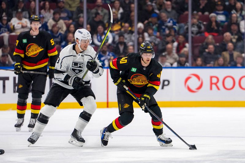 Mar 25, 2024; Vancouver, British Columbia, CAN; Los Angeles Kings forward Adrian Kempe (9) pursues Vancouver Canucks forward Elias Pettersson (40) in the first period at Rogers Arena. Mandatory Credit: Bob Frid-USA TODAY Sports