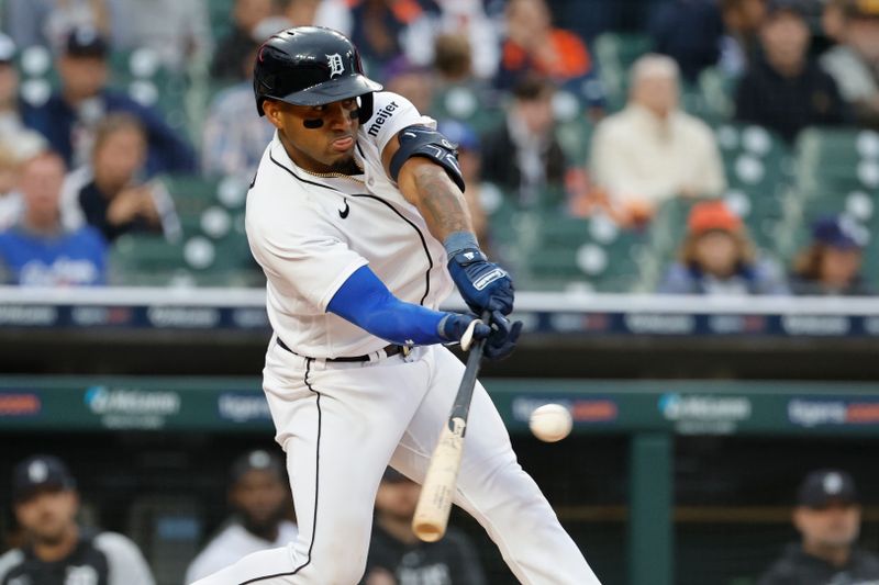 Sep 28, 2023; Detroit, Michigan, USA; Detroit Tigers second baseman Andy Ibanez (77) hits an RBI single in the seventh inning against the Kansas City Royals at Comerica Park. Mandatory Credit: Rick Osentoski-USA TODAY Sports