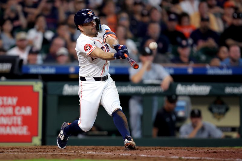 Aug 18, 2024; Houston, Texas, USA; Houston Astros designated hitter Jose Altuve (27) hits a home run to left field against the Chicago White Sox during the eighth inning at Minute Maid Park. Mandatory Credit: Erik Williams-USA TODAY Sports