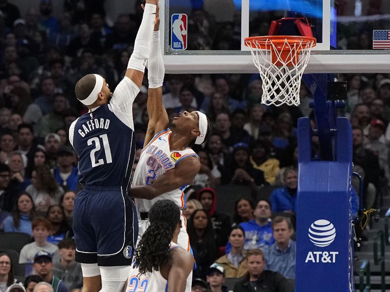 DALLAS, TEXAS - FEBRUARY 10: Daniel Gafford #21 of the Dallas Mavericks makes a move to the basket over Shai Gilgeous-Alexander #2 of the Oklahoma City Thunder during the second half at American Airlines Center on February 10, 2024 in Dallas, Texas. NOTE TO USER: User expressly acknowledges and agrees that, by downloading and or using this photograph, User is consenting to the terms and conditions of the Getty Images License Agreement. (Photo by Sam Hodde/Getty Images)