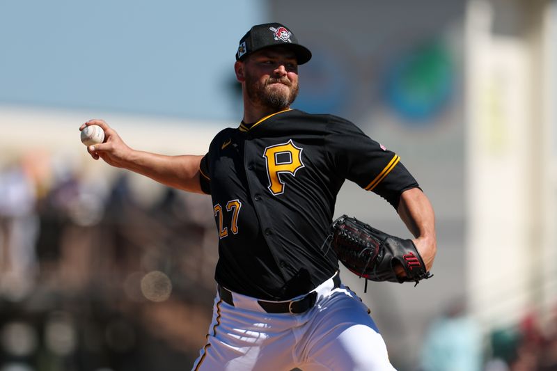 Mar 7, 2025; Bradenton, Florida, USA; Pittsburgh Pirates pitcher Tanner Rainey (27) throws a pitch against the Philadelphia Phillies in the sixth inning during spring training at LECOM Park. Mandatory Credit: Nathan Ray Seebeck-Imagn Images