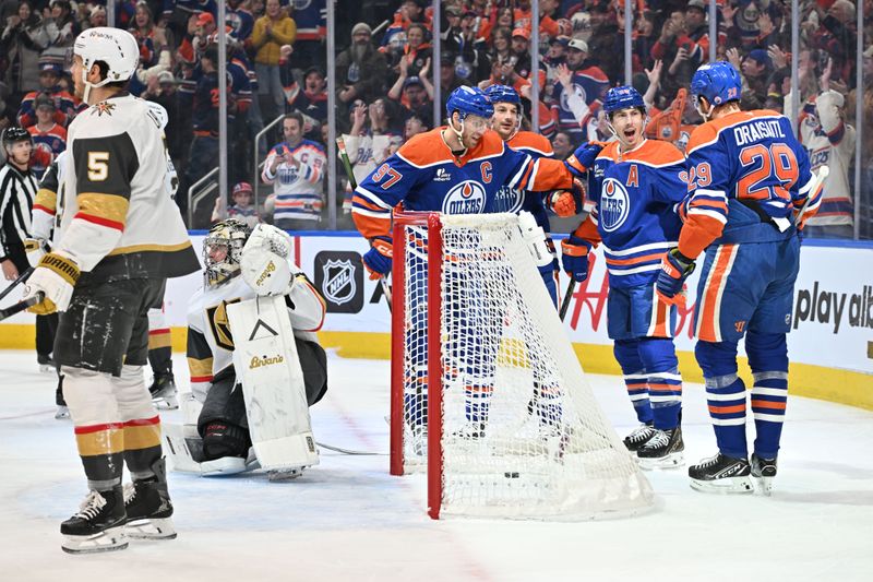Dec 21, 2025; Edmonton, Alberta, CAN; Edmonton Oilers center Connor McDavid (97) with Oilers center Leon Draisaitl (29) and OIlers center Ryan Ngent-Hopkins (93) celebrate a goal on Vegas Golden Knights goalie Carter Hart (79) during the first period at Rogers Place. Mandatory Credit: Walter Tychnowicz-Imagn Images