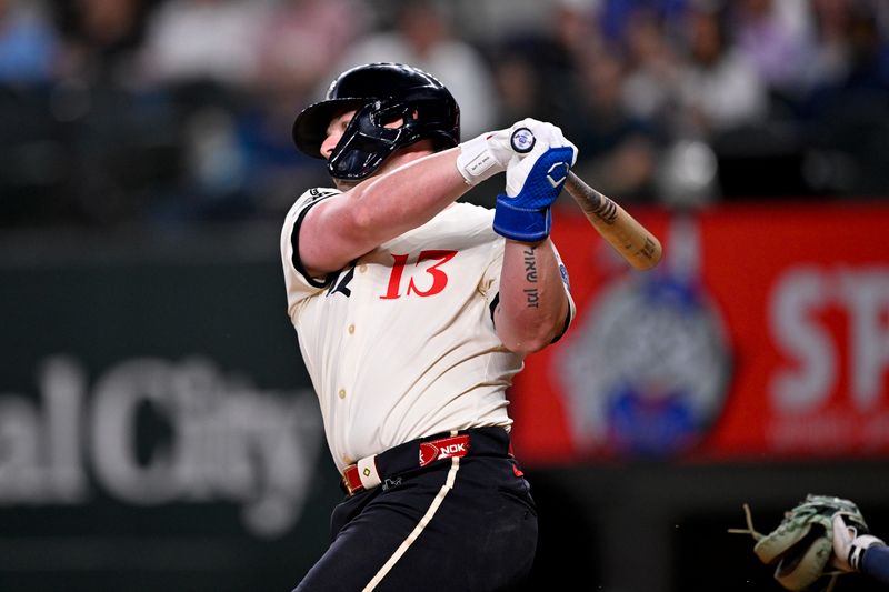 May 2, 2025; Arlington, Texas, USA; Texas Rangers first baseman Blaine Crim (13) strikes out in his first major league at bat during the third inning against the Seattle Mariners at Globe Life Field. Mandatory Credit: Jerome Miron-Imagn Images