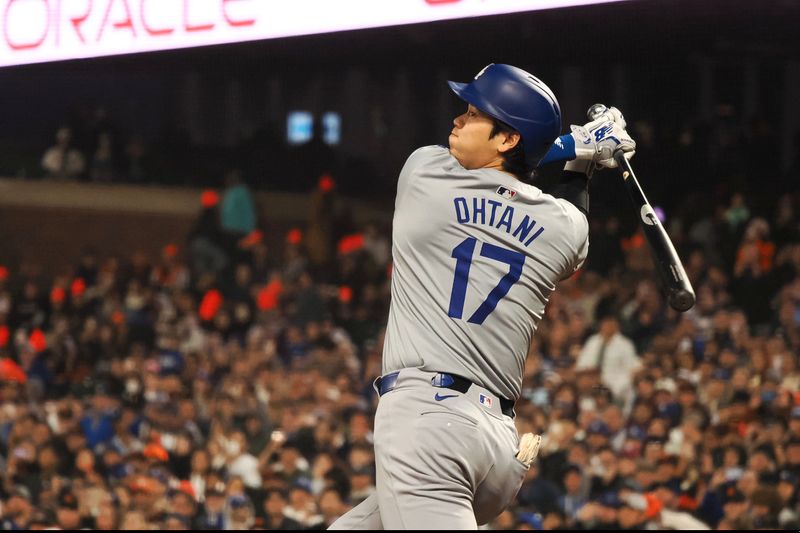 May 14, 2024; San Francisco, California, USA; Los Angeles Dodgers designated hitter Shohei Ohtani (17) hits a RBI double against the San Francisco Giants during the seventh inning at Oracle Park. Mandatory Credit: Kelley L Cox-USA TODAY Sports