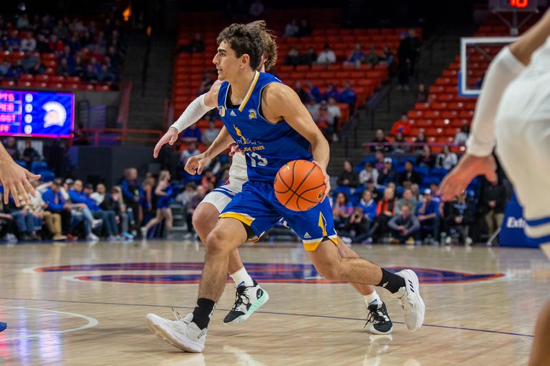 Jan 3, 2023; Boise, Idaho, USA; San Jose State Spartans guard Alvaro Cardenas (13) dribbles the ball during the first half against the Boise State Broncos at ExtraMile Arena. Mandatory Credit: Brian Losness-USA TODAY Sports