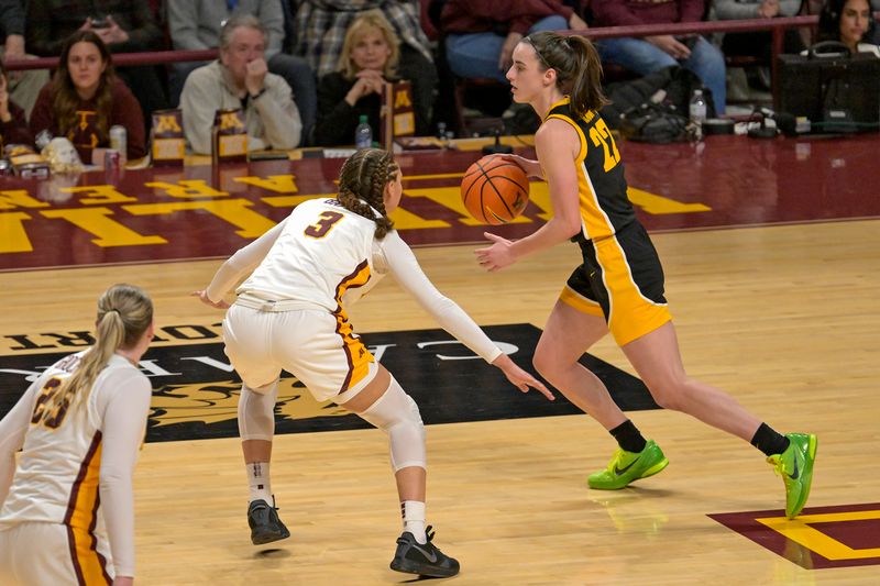 Feb 28, 2024; Minneapolis, Minnesota, USA; Iowa Hawkeyes guard Caitlin Clark (22) controls the ball as Minnesota Golden Gophers guard Amaya Battle (3) defends during the fourth quarter at Williams Arena. Mandatory Credit: Nick Wosika-USA TODAY Sports