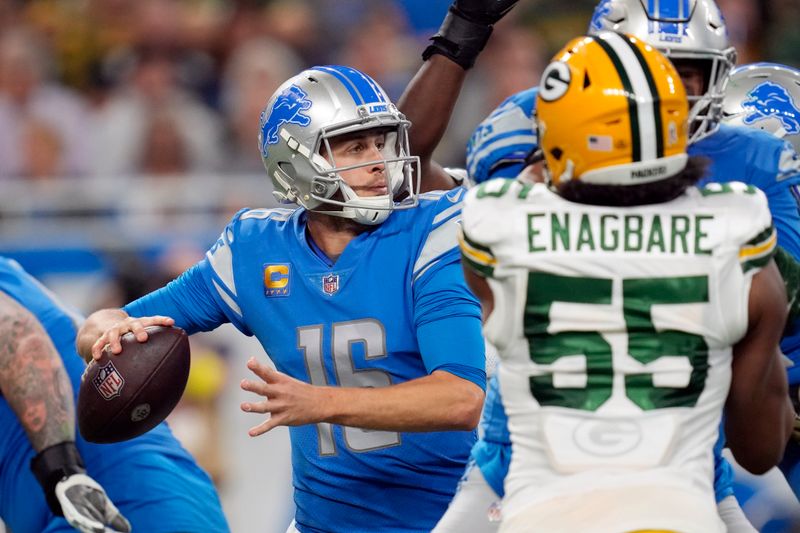 Detroit Lions quarterback Jared Goff (16) throws as Green Bay Packers linebacker Kingsley Enagbare (55) pressures during the second half of an NFL football game, Sunday, Nov. 6, 2022, in Detroit. (AP Photo/Paul Sancya)
