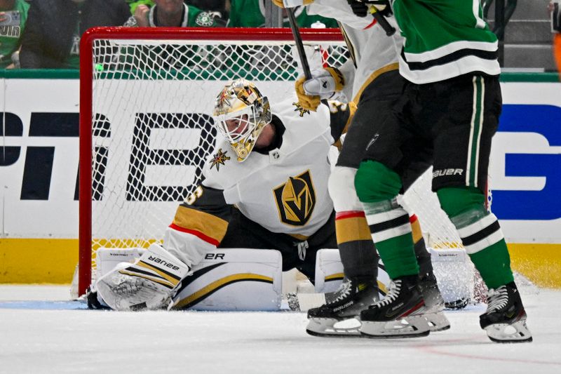 Apr 24, 2024; Dallas, Texas, USA; Vegas Golden Knights goaltender Logan Thompson (36) makes a glove save on a Dallas Stars shot during the third period in game two of the first round of the 2024 Stanley Cup Playoffs at American Airlines Center. Mandatory Credit: Jerome Miron-USA TODAY Sports