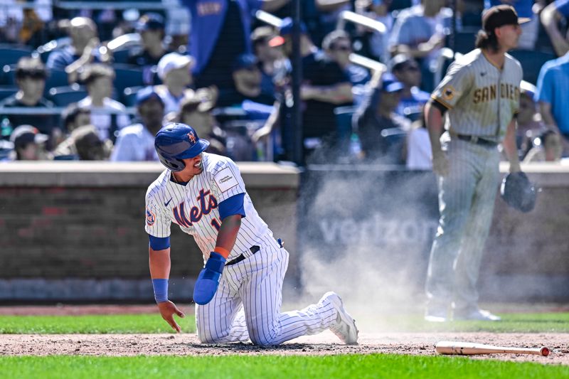 Apr 12, 2023; New York City, New York, USA; New York Mets third baseman Eduardo Escobar (10) scores on an RBI single by New York Mets center fielder Brandon Nimmo (not pictured) during the sixth inning against the San Diego Padres at Citi Field. Mandatory Credit: John Jones-USA TODAY Sports