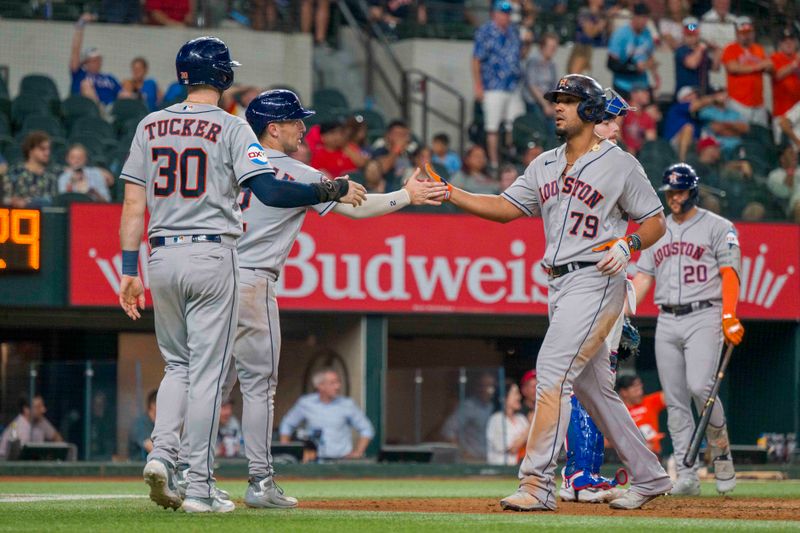 Sep 6, 2023; Arlington, Texas, USA; Houston Astros first baseman Jose Abreu (79) and third baseman Alex Bregman (2) and right fielder Kyle Tucker (30) celebrate after Abreu hits a three run home run against the Texas Rangers during the ninth inning at Globe Life Field. Mandatory Credit: Jerome Miron-USA TODAY Sports