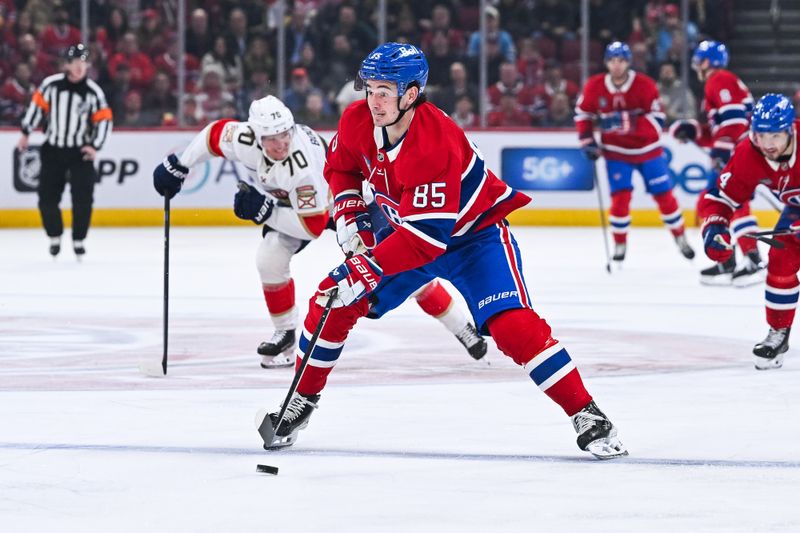 Jan 8, 2026; Montreal, Quebec, CAN; Montreal Canadiens left wing Alexandre Texier (85) plays the puck against the Florida Panthers during the third period at Bell Centre. Mandatory Credit: David Kirouac-Imagn Images