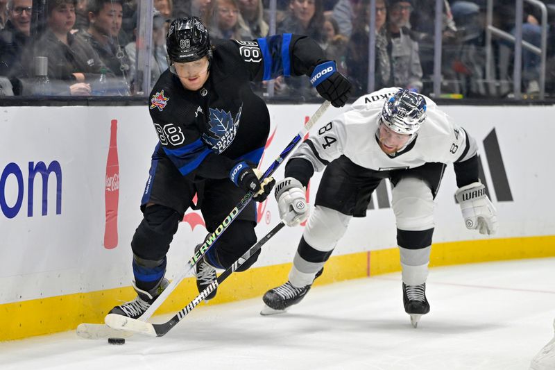 Jan 2, 2024; Los Angeles, California, USA; Toronto Maple Leafs right wing William Nylander (88) and Los Angeles Kings defenseman Vladislav Gavrikov (84) battle for the puck in the third period at Crypto.com Arena. Mandatory Credit: Jayne Kamin-Oncea-USA TODAY Sports